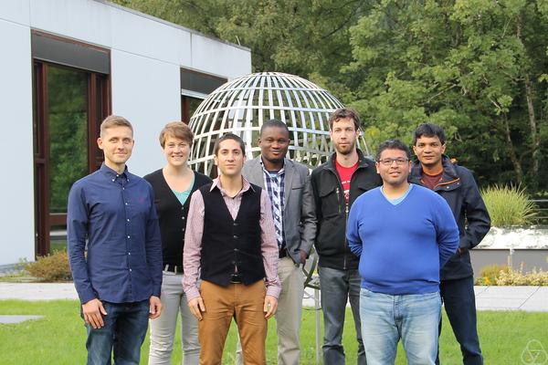 Group of early career researchers in front of the Boy surface in Oberwolfach